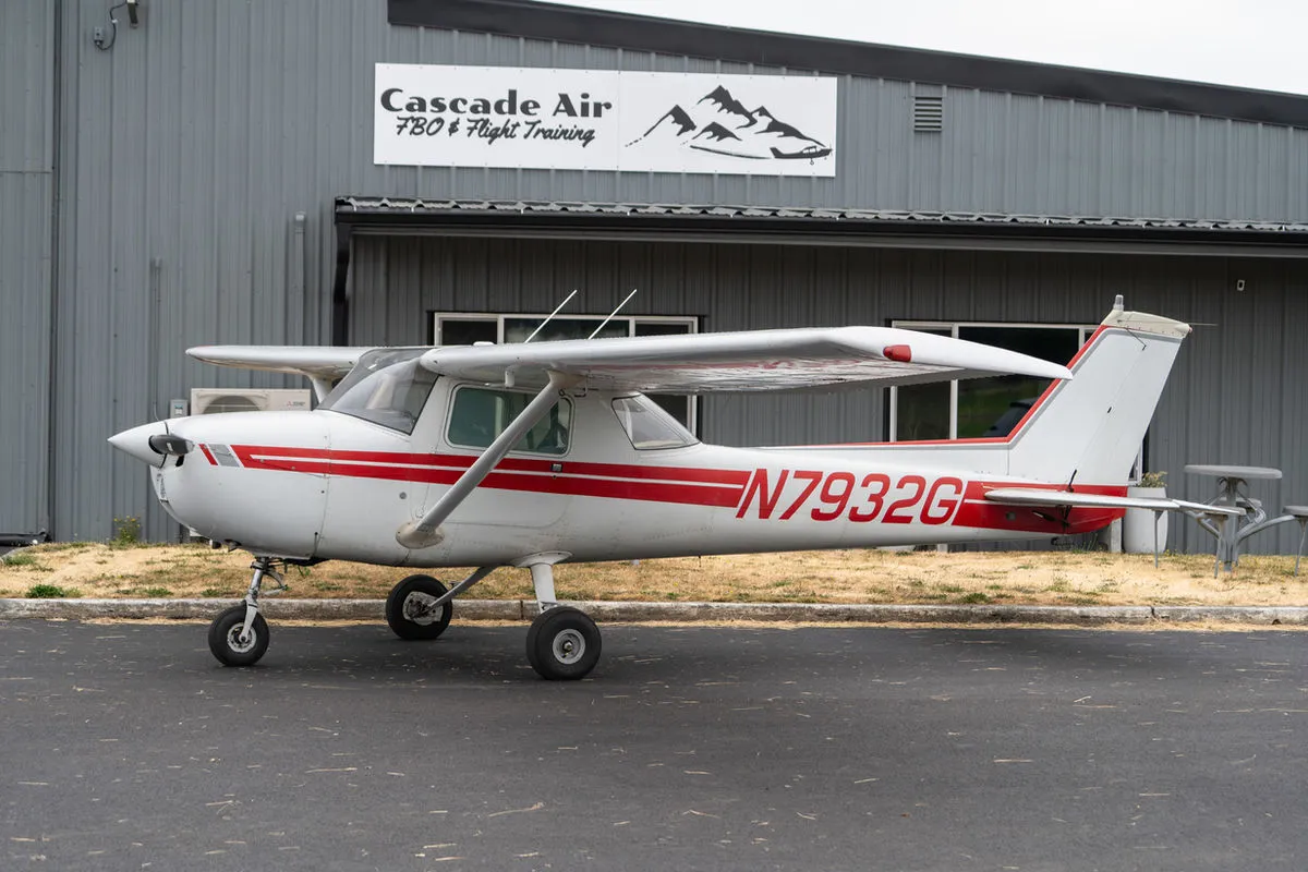 Cessna 150L N7932G parked in front of the Cascade Air hangar at KKLS.