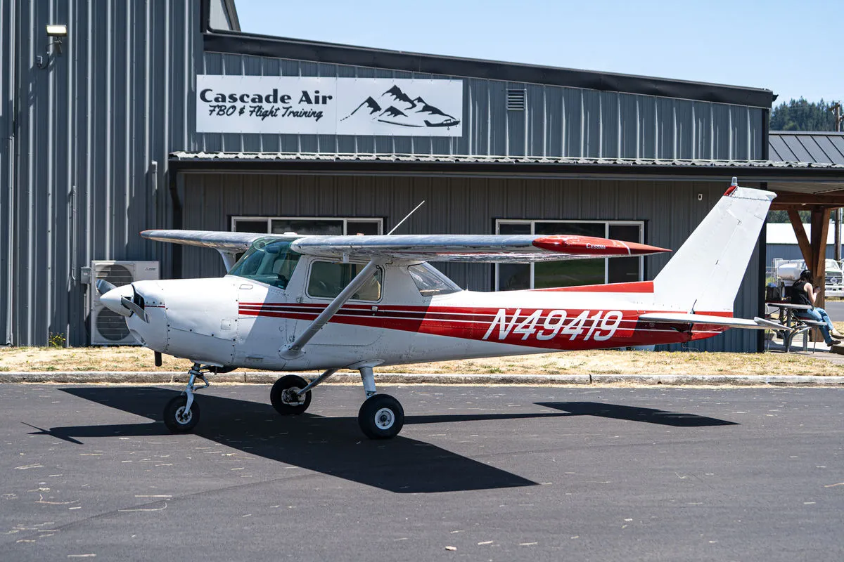 Cessna 152 N49149 parked in front of the Cascade Air hangar at KKLS.