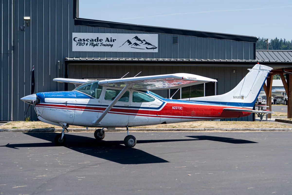 Cessna 182RG N2373C parked in front of the Cascade Air hangar at KKLS.