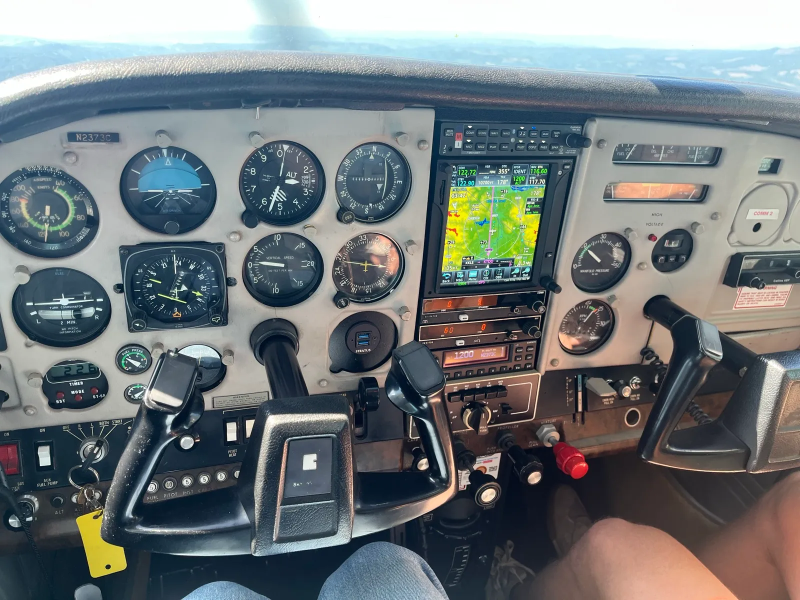 Cascade Air aircraft cockpit panel with Garmin avionics in flight.